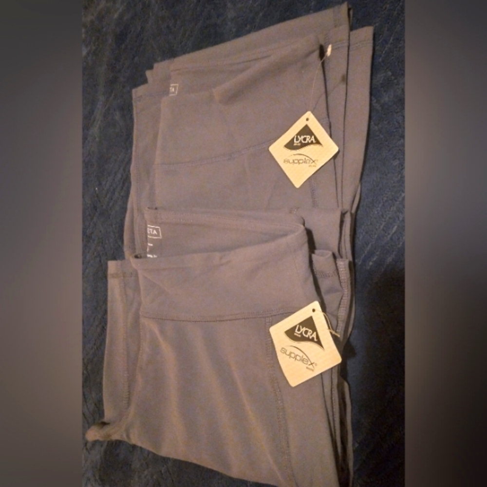 2 pairs Athleta flare-leg yoga pants. Size petite medium